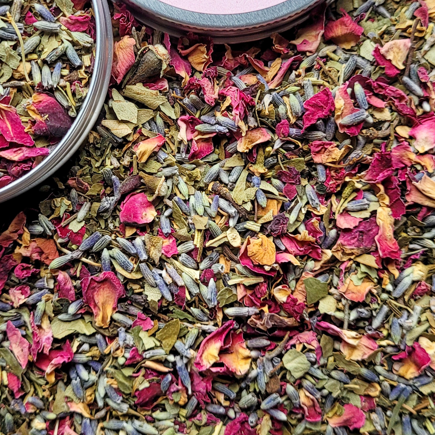 Colorful mix of dried flowers and herbs in a container