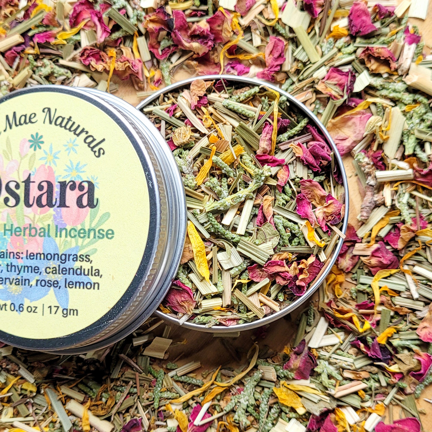 Mae Naturals Astara Herbal Incense in a metal container surrounded by incense sticks.