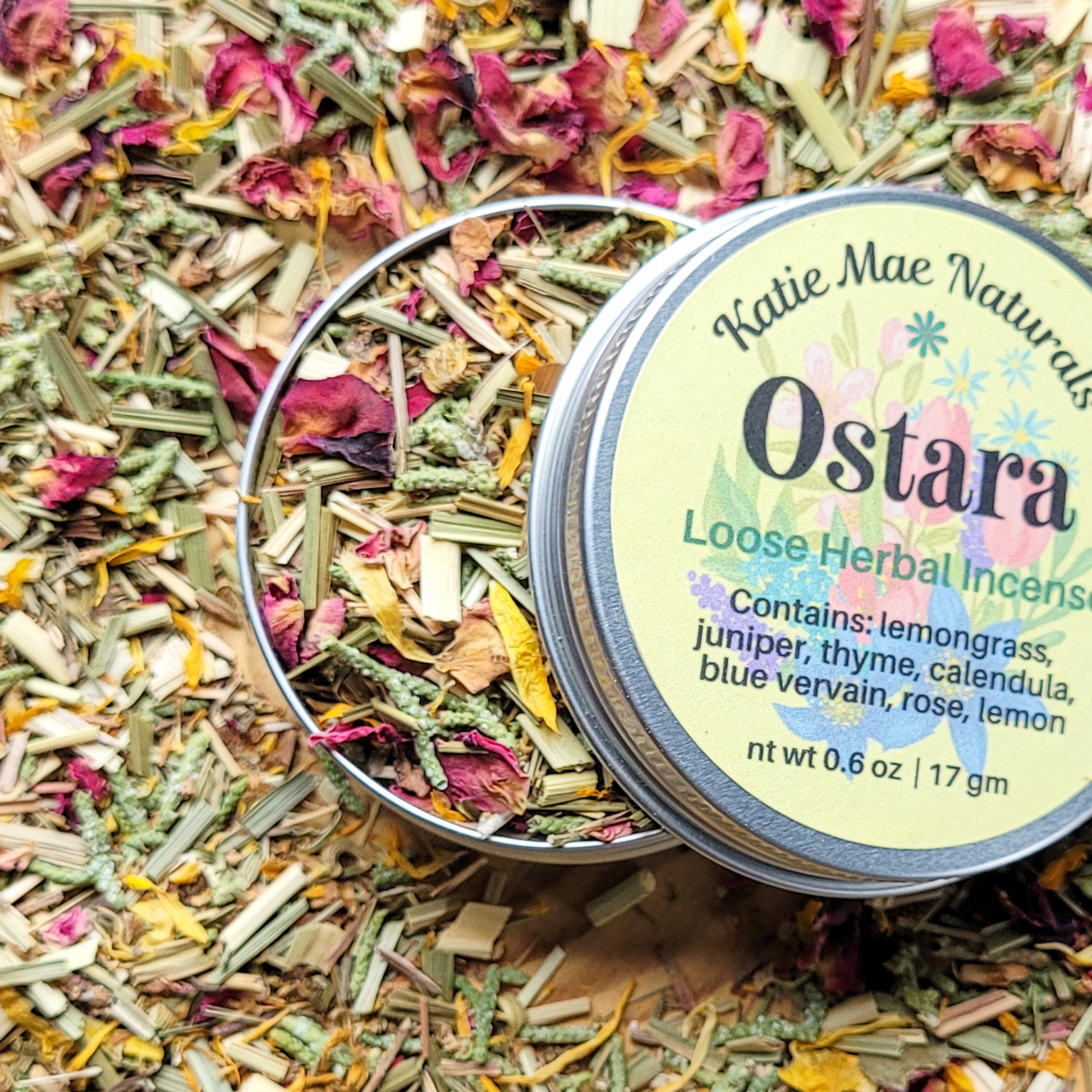 Loose herbal incense in a tin with 'Katie Mae Naturals Ostara' label.