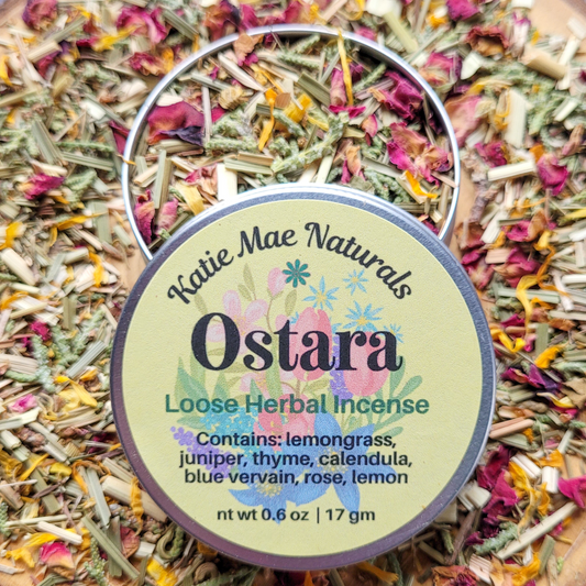 Katie Mae Naturals Ostara Loose Herbal Incense with colorful packaging on a bed of incense.