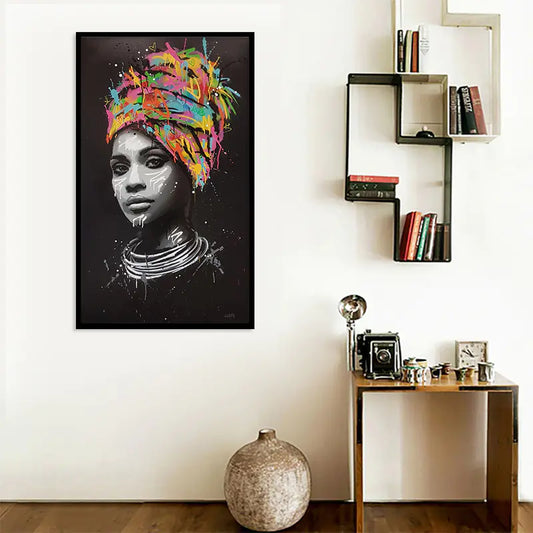 Framed artwork of a woman with a colorful headscarf in a modern interior setting.