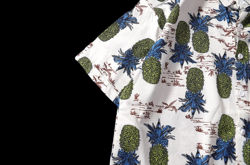 Fabric with pineapple and floral pattern on a white background