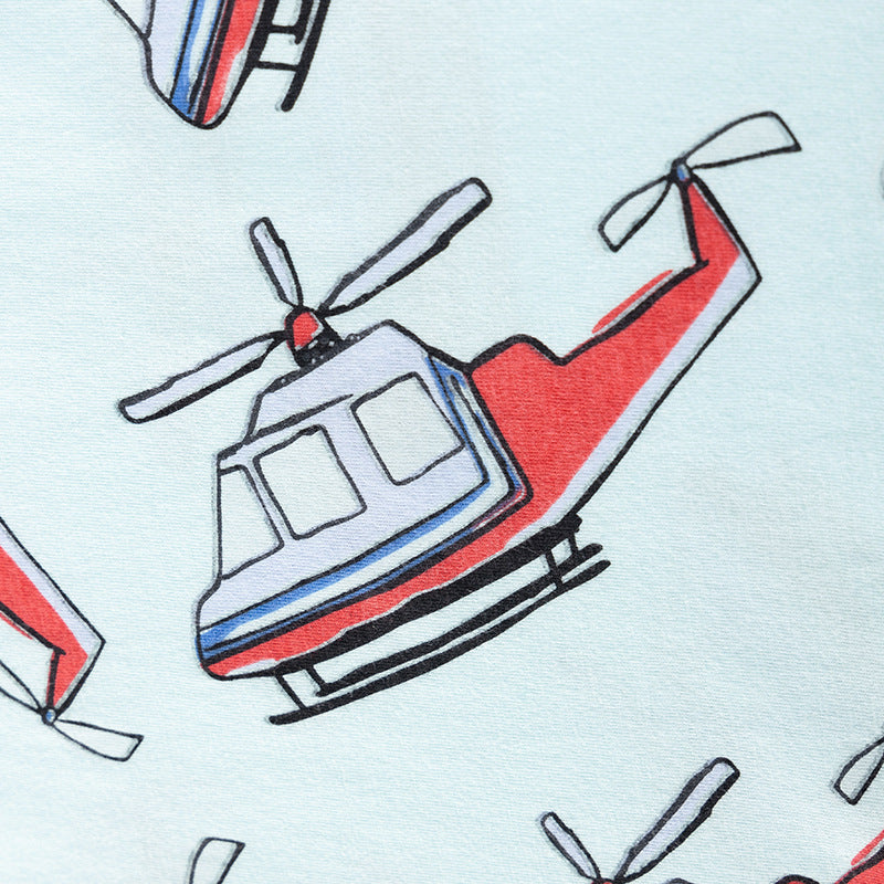 Pattern of red and blue helicopters on a light blue background