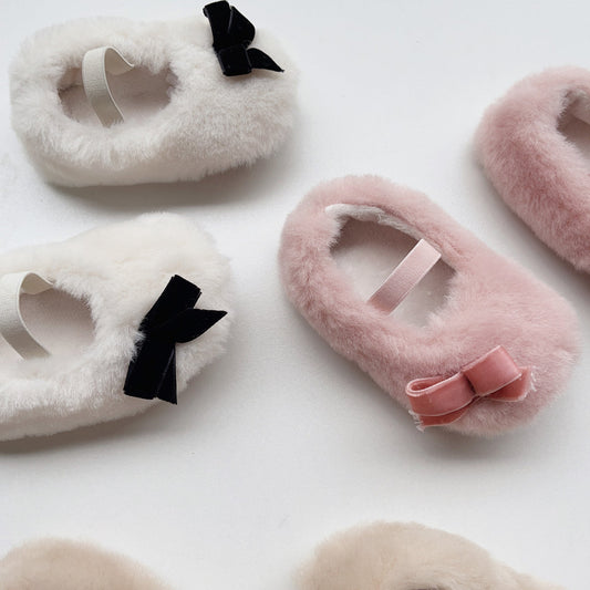 Fuzzy headbands with bows on a white background