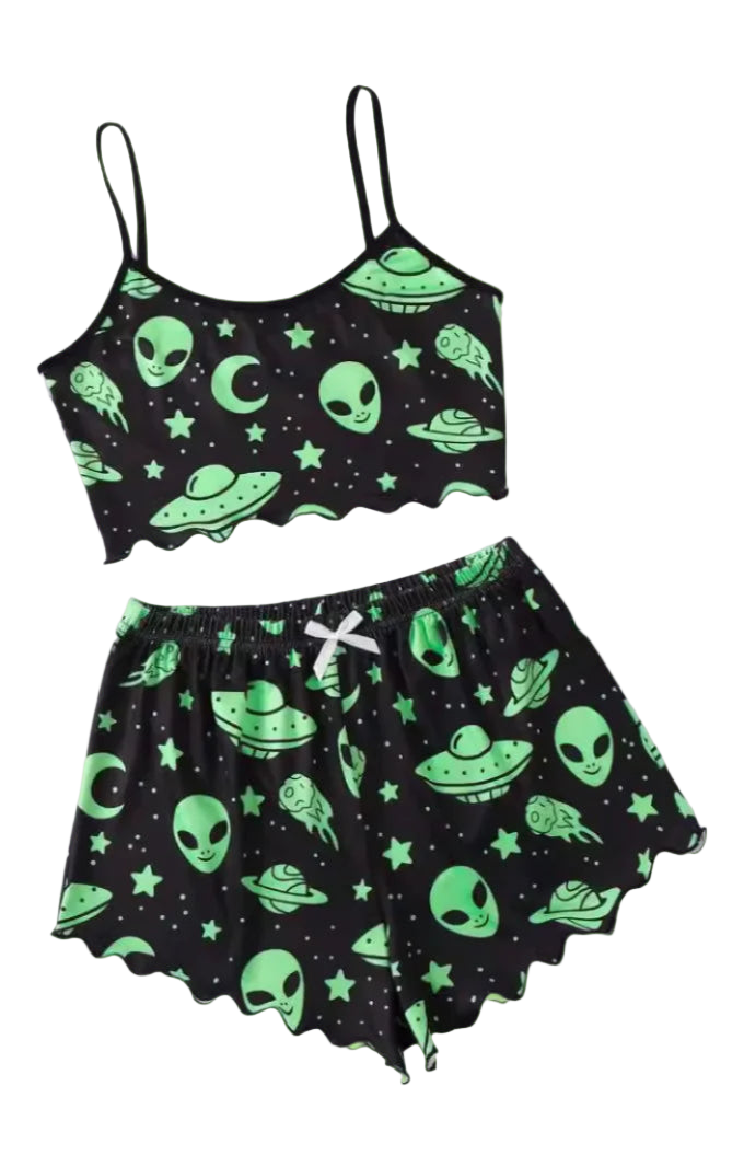 Black tank top and shorts set with green alien and UFO patterns on a white surface.