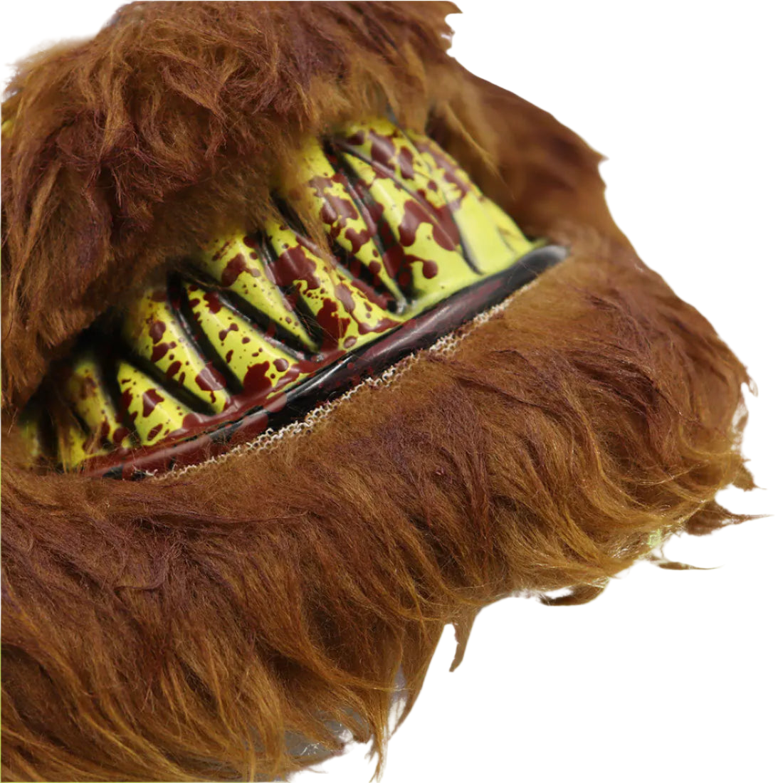 Close-up of a furry mask with yellow and red textured mouth area on a white background