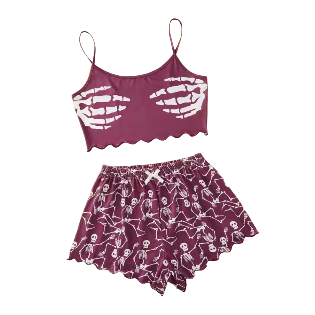 Purple pajama set with skeleton design on a white background