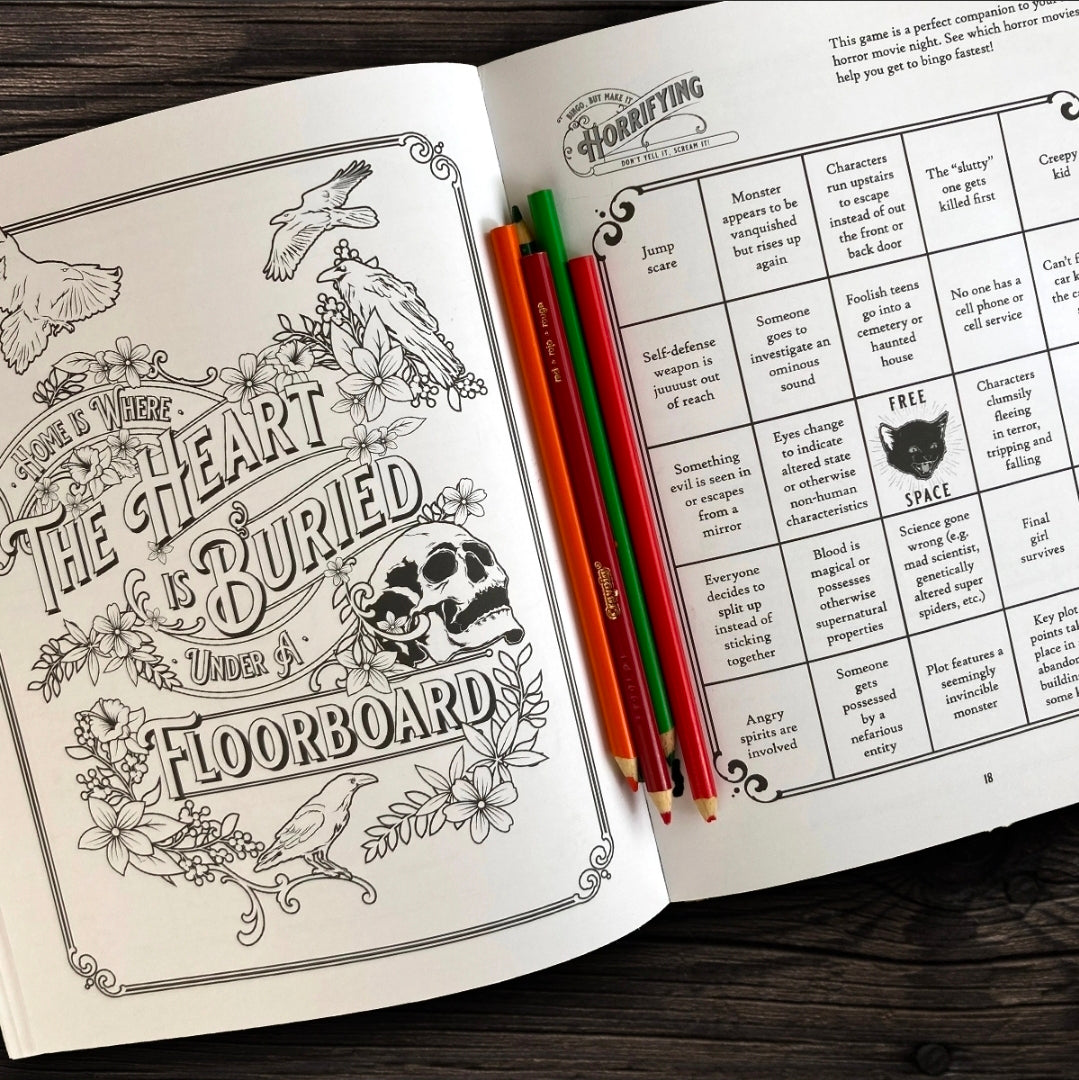 Open book with coloring page and text on a wooden surface