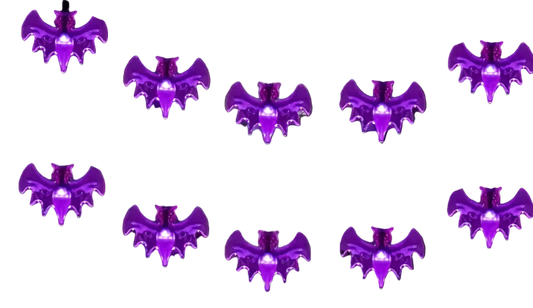 Halloween-themed decorations with purple bat lights and carved pumpkins.
