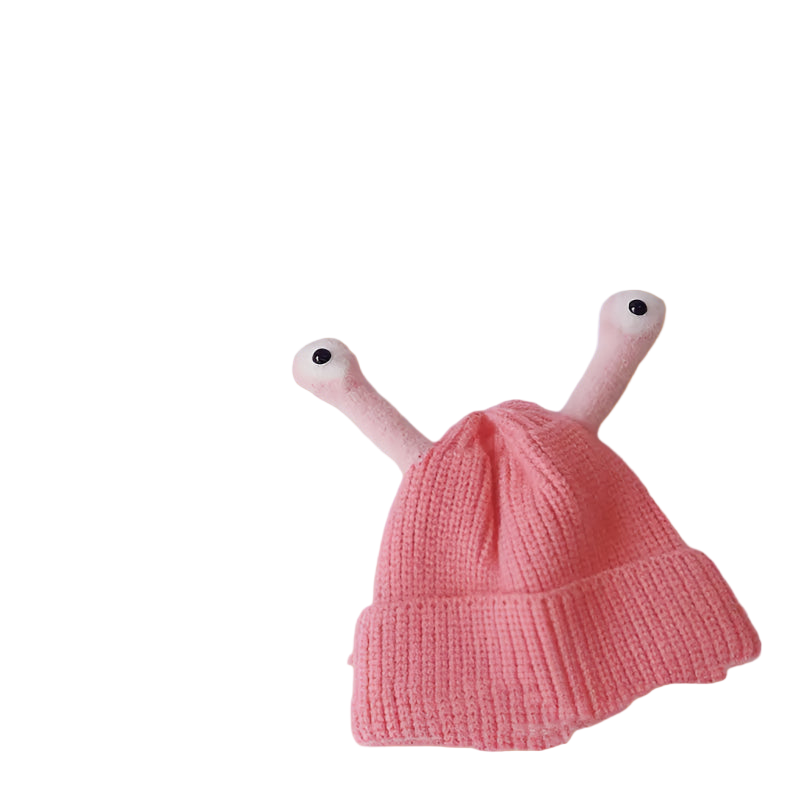 Pink knitted hat with arm and eye attachments on a light gray background