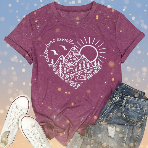 Purple t-shirt with nature graphic and text, paired with white sneakers and jeans on a white background