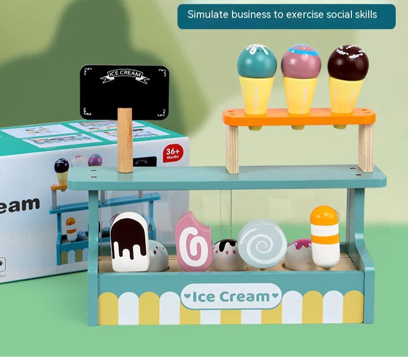 Toy ice cream shop set with colorful ice cream cones and a sign on a green background