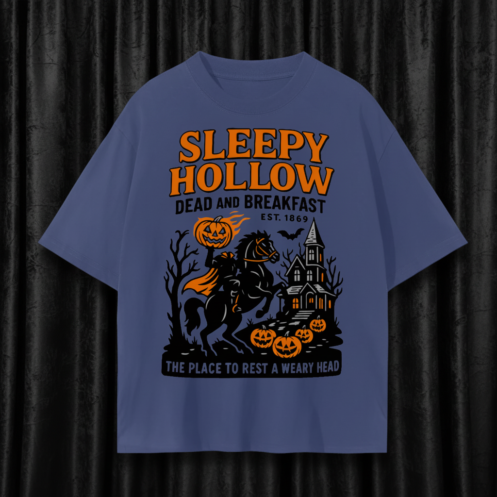 Blue t-shirt with 'Sleepy Hollow' Halloween-themed design featuring a horse, pumpkins, and a house.