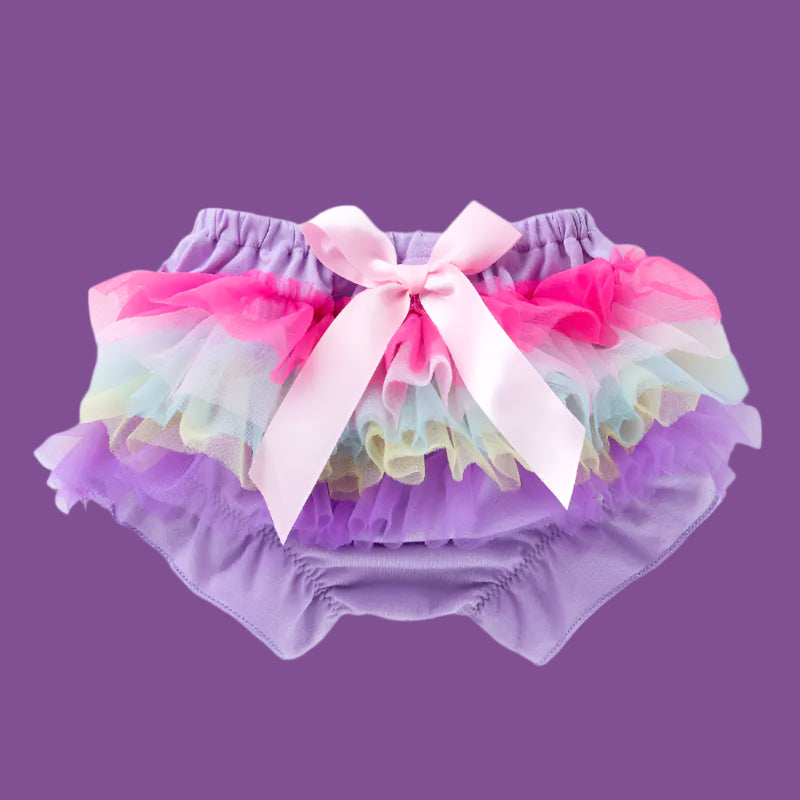 Colorful tutu with a pink bow on a white background