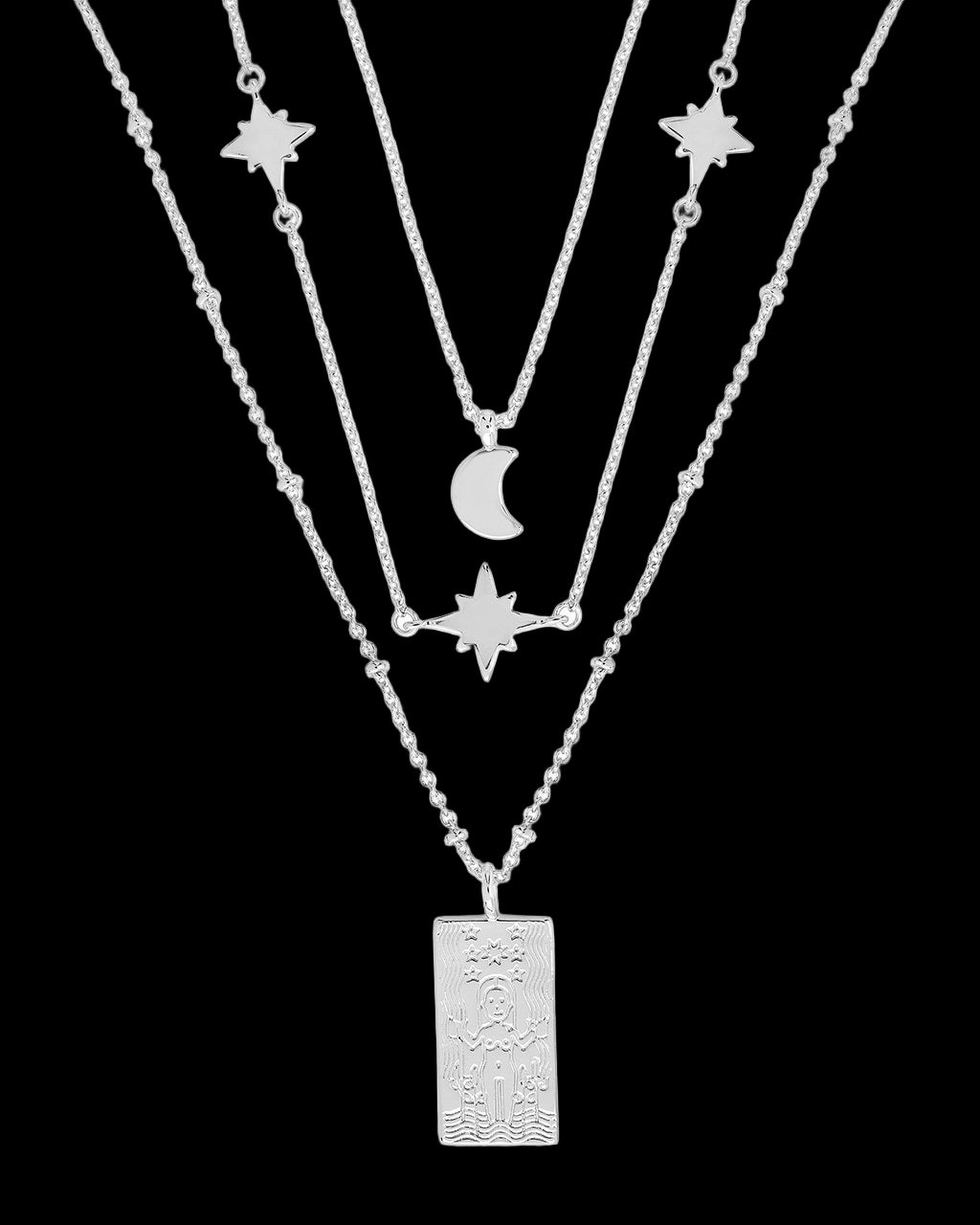 Silver necklace with star and moon pendants on a white background