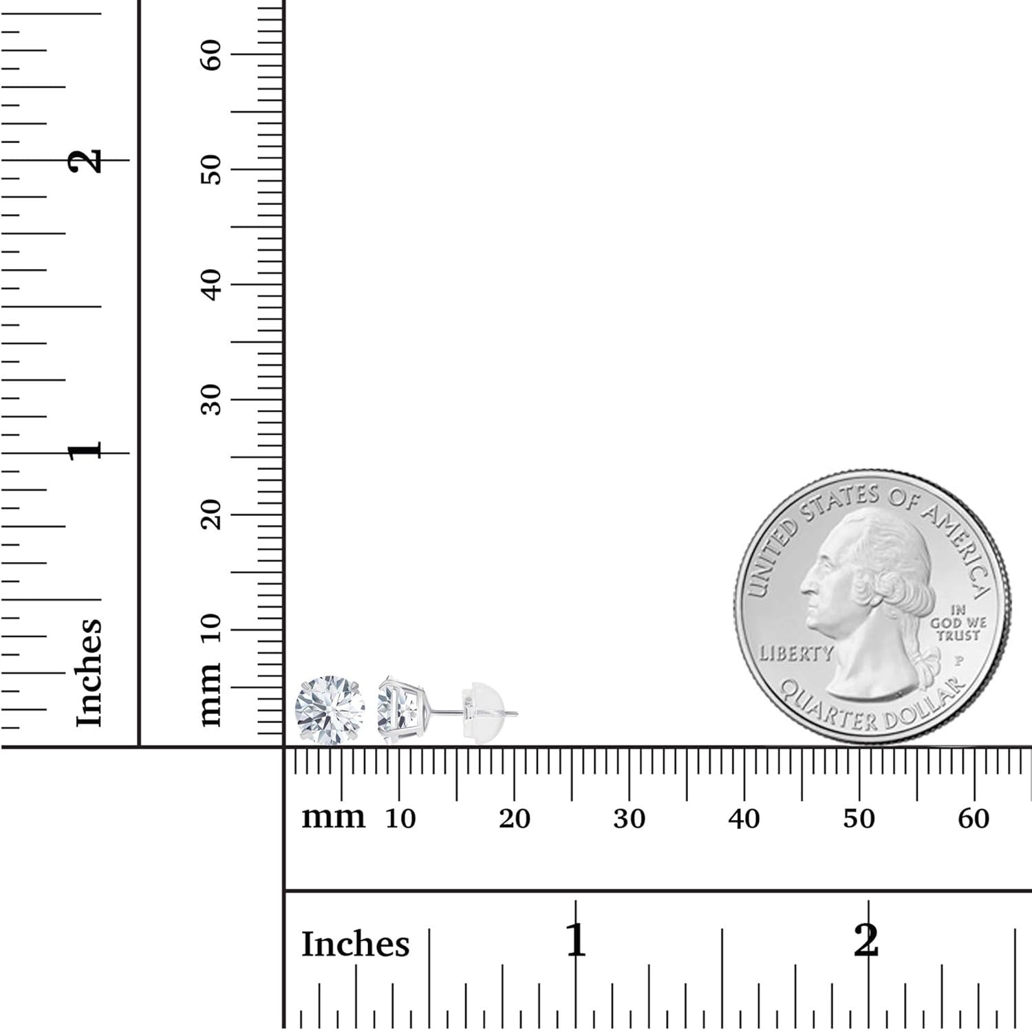 Small silver earrings next to a ruler and a quarter for size comparison
