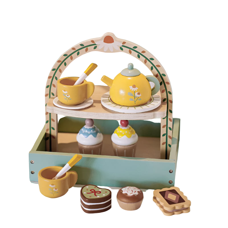 Children's toy tea set with a wooden stand, cups, teapot, and cookies on a light surface.