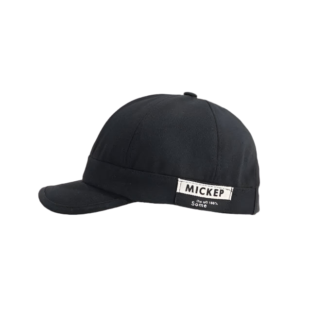 Black cap with a visible brand label on a white background