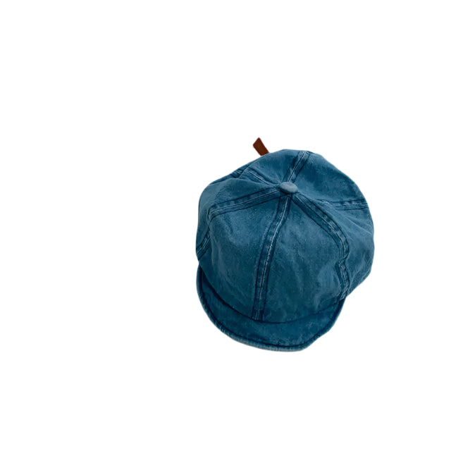 Blue denim cap on a light gray background