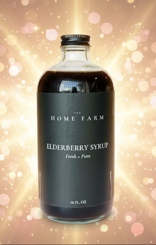 Bottle of Elderberry Syrup from The Home Farm on a light blue background
