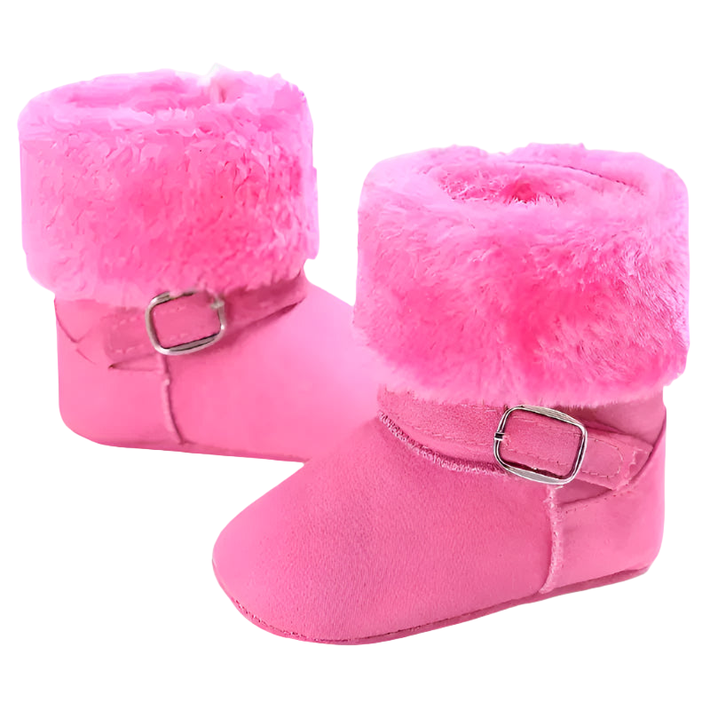 Pink baby boots with fluffy tops on a white background