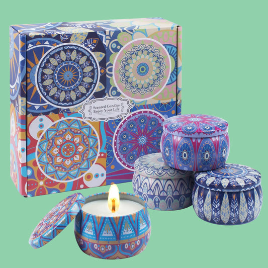 Set of decorative candles with colorful packaging on a white background