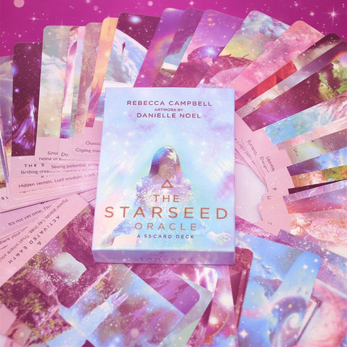 Starseed Oracle card deck with colorful cards and packaging.