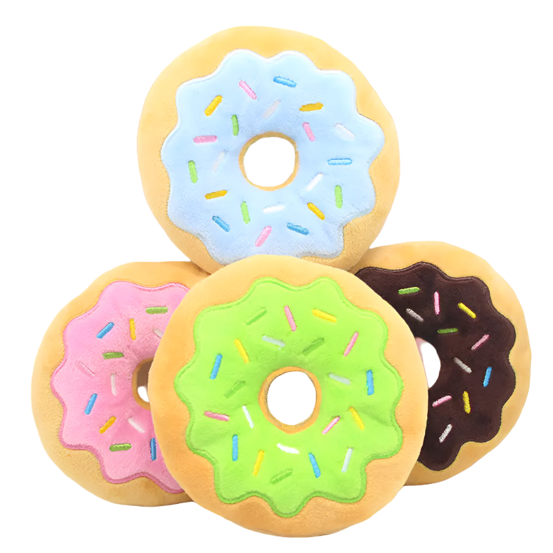 Four colorful donut-shaped cushions with different colored icing on a white background