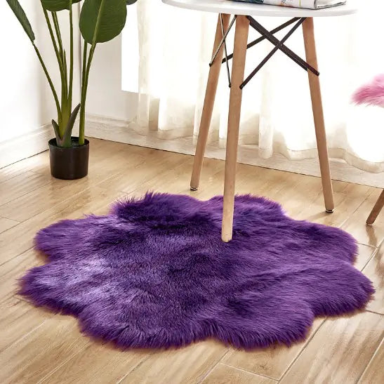 Purple fluffy rug on a wooden floor with a chair and plant in the background