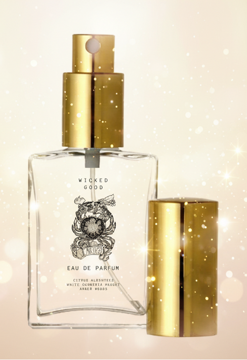 Perfume bottle with gold cap and label on a beige background