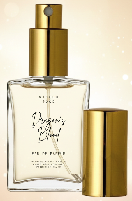 Perfume bottle labeled 'Wicked Good Dragon's Blood' with gold cap on a beige background