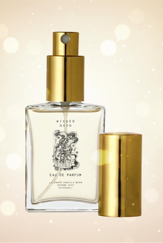 Perfume bottle with gold cap and 'Wicked Good' label on a beige background