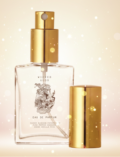 Wicked Good Eau de Parfum bottle with gold cap on a beige background