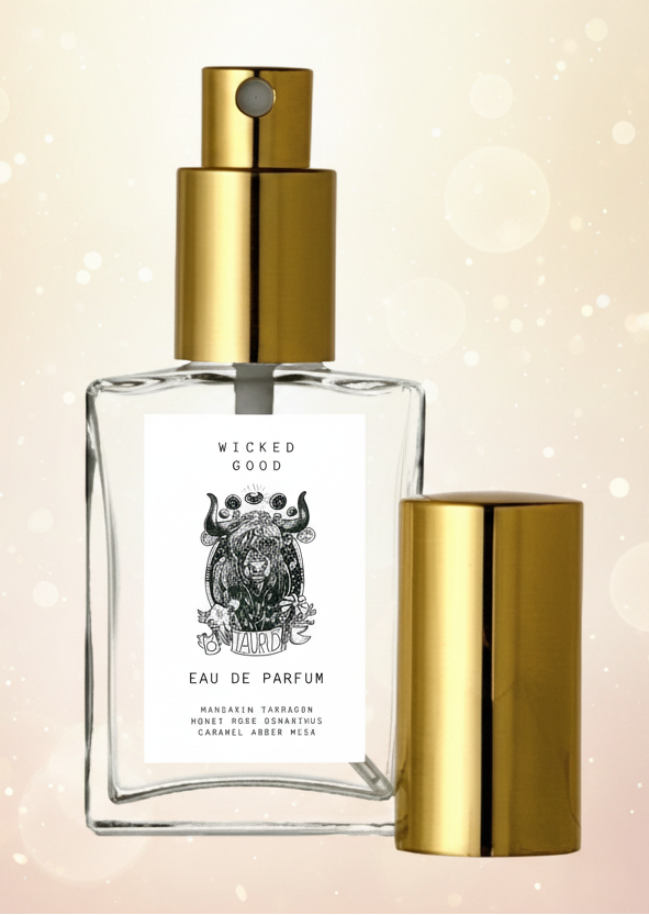 Eau de Parfum bottle with gold cap and label on a light background