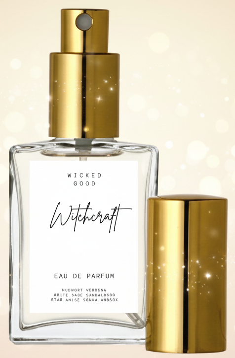 Perfume bottle with gold cap and label on a soft, blurred background