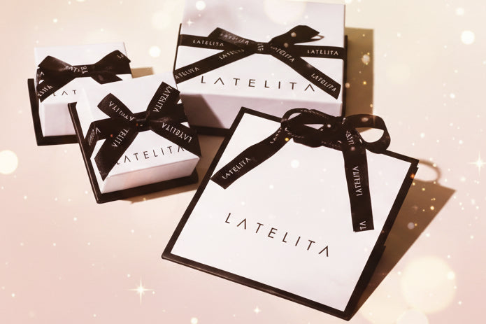 LATELITA product packaging with black ribbons on a light background