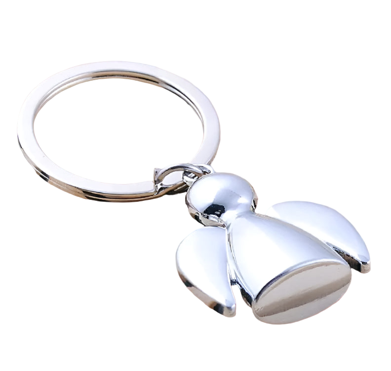 Silver bell-shaped keychain on a wooden surface