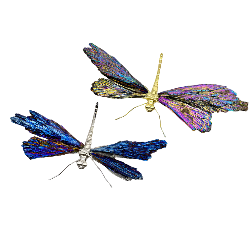 Two butterfly-shaped brooches, one blue and one multicolored, on a light gray background.