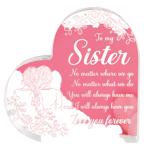 Heart-shaped glass plaque with sister message on a pink background
