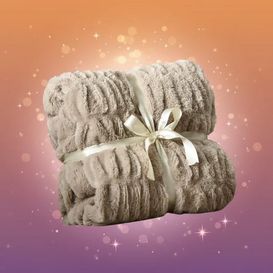 Gray textured blanket with a white ribbon on a chair