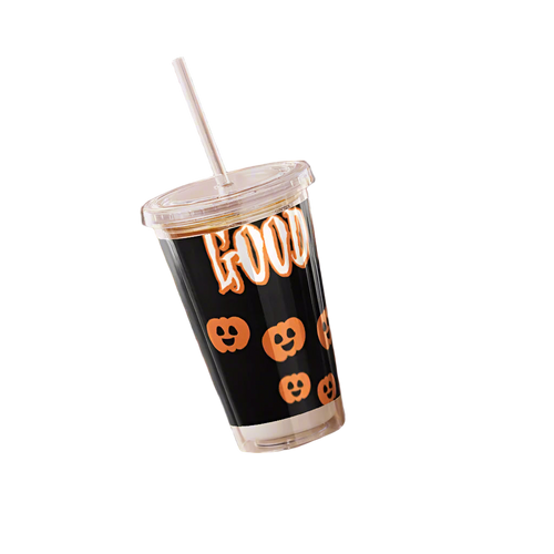 Hand holding a Halloween-themed tumbler with pumpkins and the word 'HOCUS'.